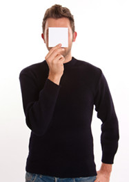 Young Man with a blank paper hiding his face
